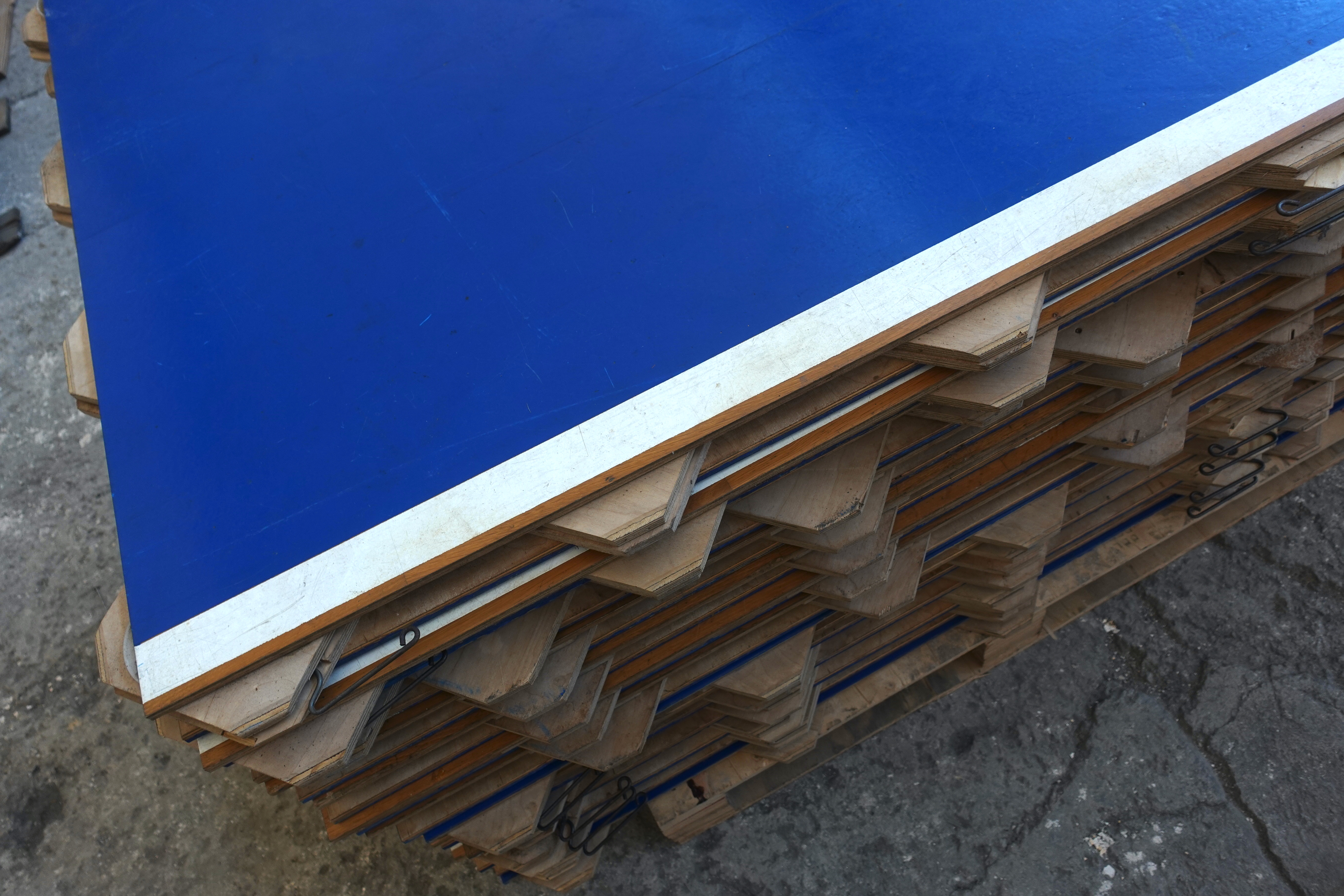 Blue sports flooring surface with signs of use