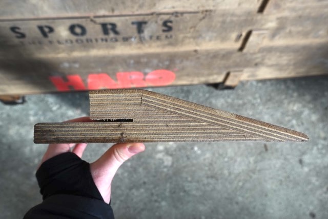 Cross-section showing the layered wooden construction and tapered edge