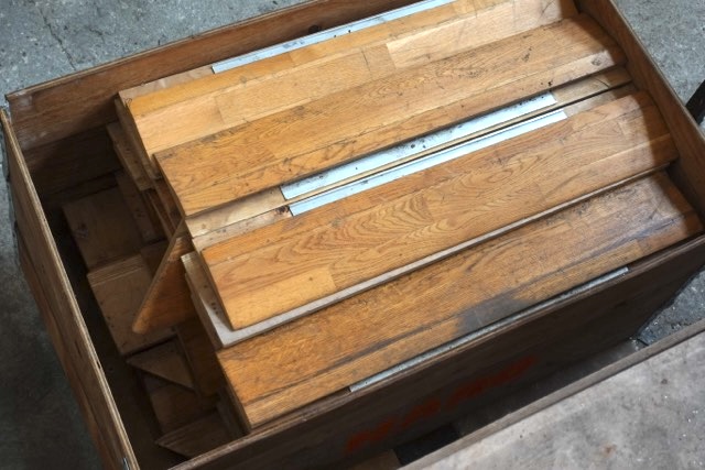 Recovered HARO edge trim elements stored in a wooden crate