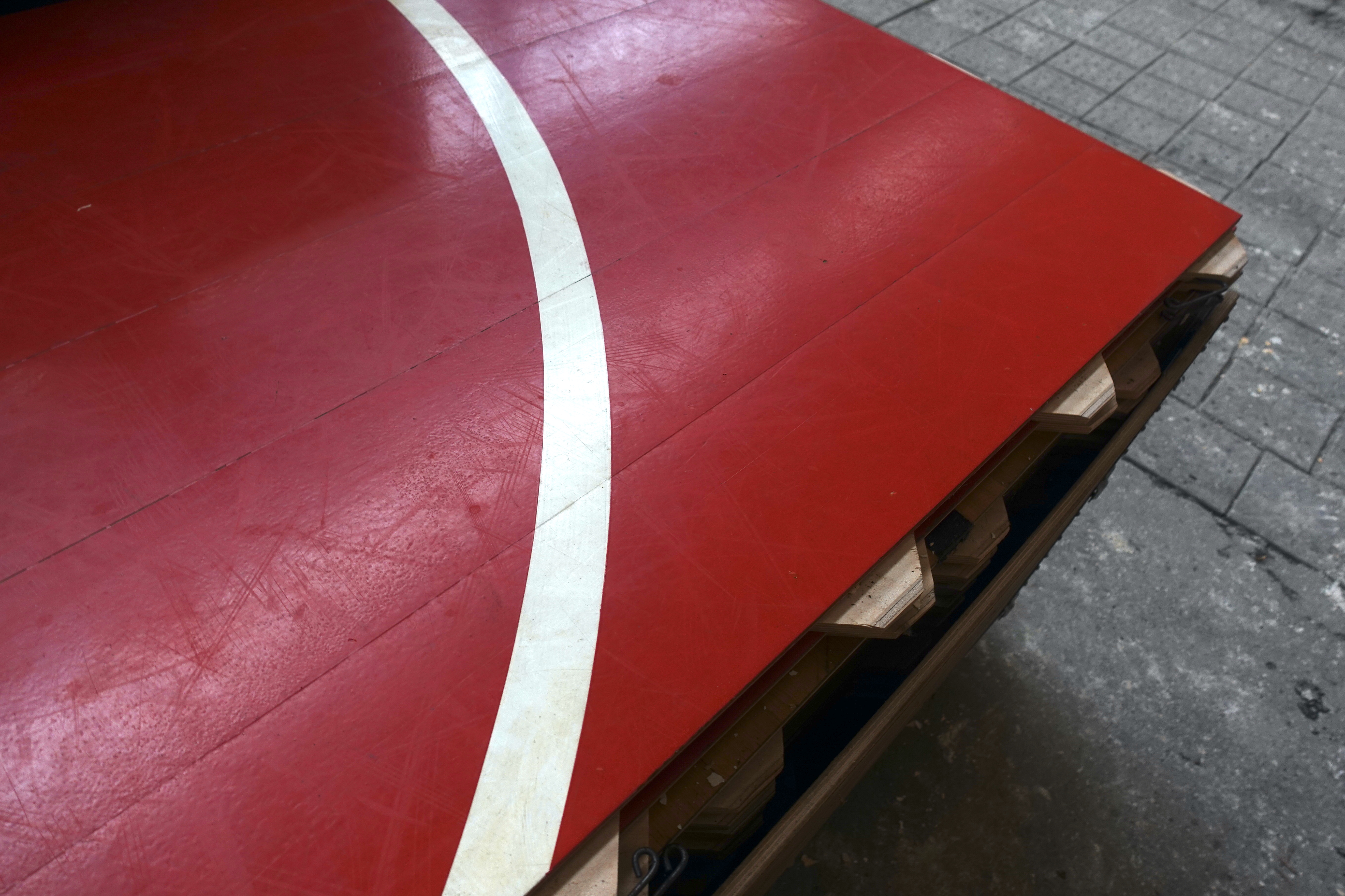 Red sports flooring with white court line